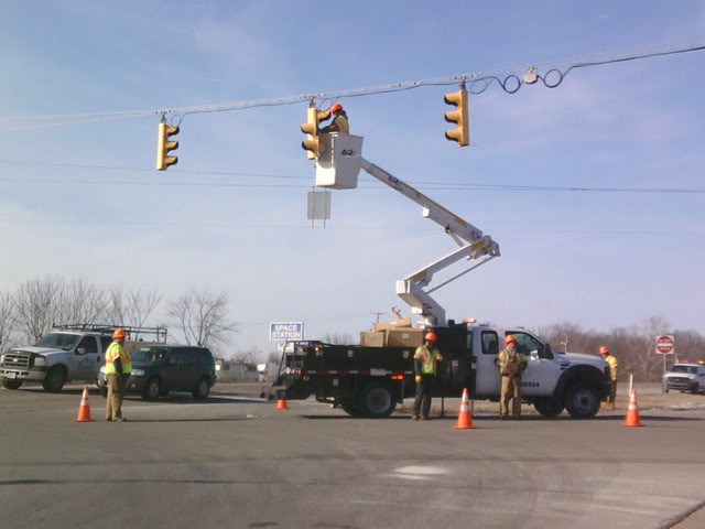 How many DOT workers does it take to change a light bulb?